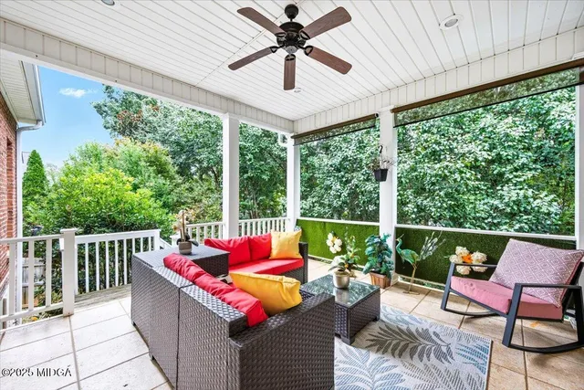 a outdoor dining space with furniture and garden view
