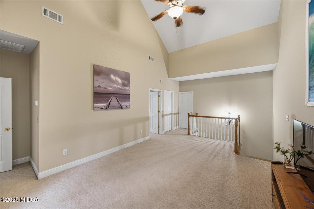 855 Tufthunter Macon, GA 31210 - Photo 28 of 38 a view of a livingroom with a chandelier fan