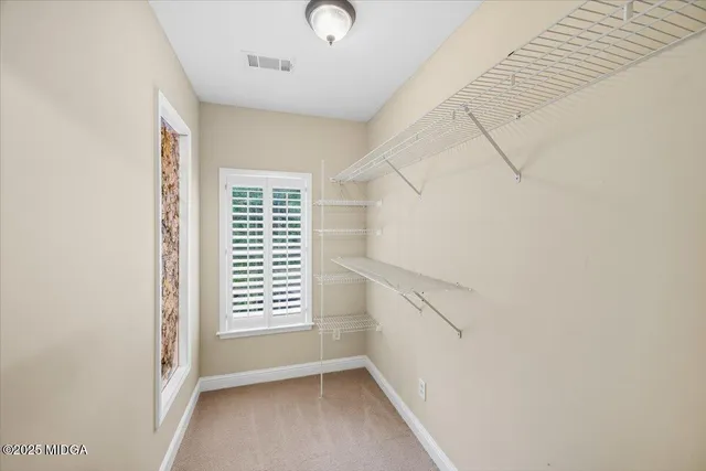 a bathroom with a sink double vanity granite tub shower and a mirror