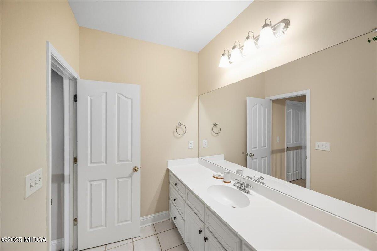 855 Tufthunter Macon, GA 31210 - Photo 37 of 38 a en suite bathroom with a double vanity sink and mirror