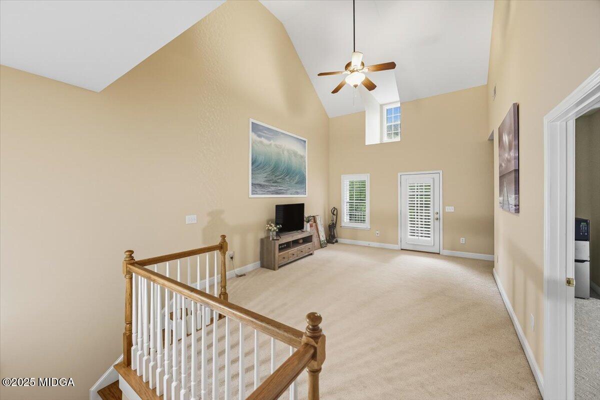 855 Tufthunter Macon, GA 31210 - Photo 38 of 38 a view of a livingroom with wooden floor and staircase