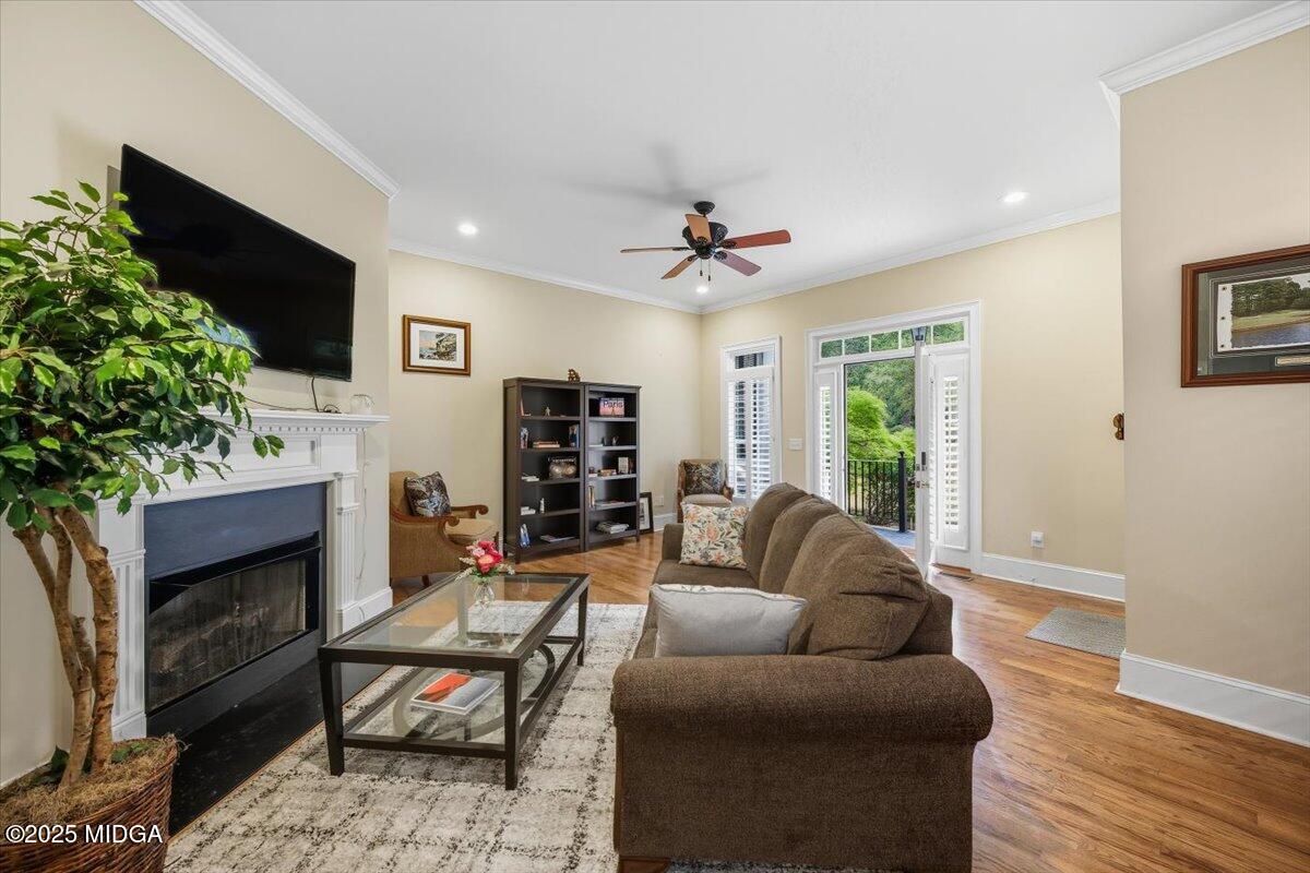 855 Tufthunter Macon, GA 31210 - Photo 8 of 38 a living room with furniture a fireplace and a flat screen tv
