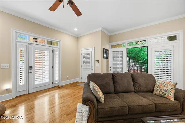 a view of a patio with table and chairs and potted plants