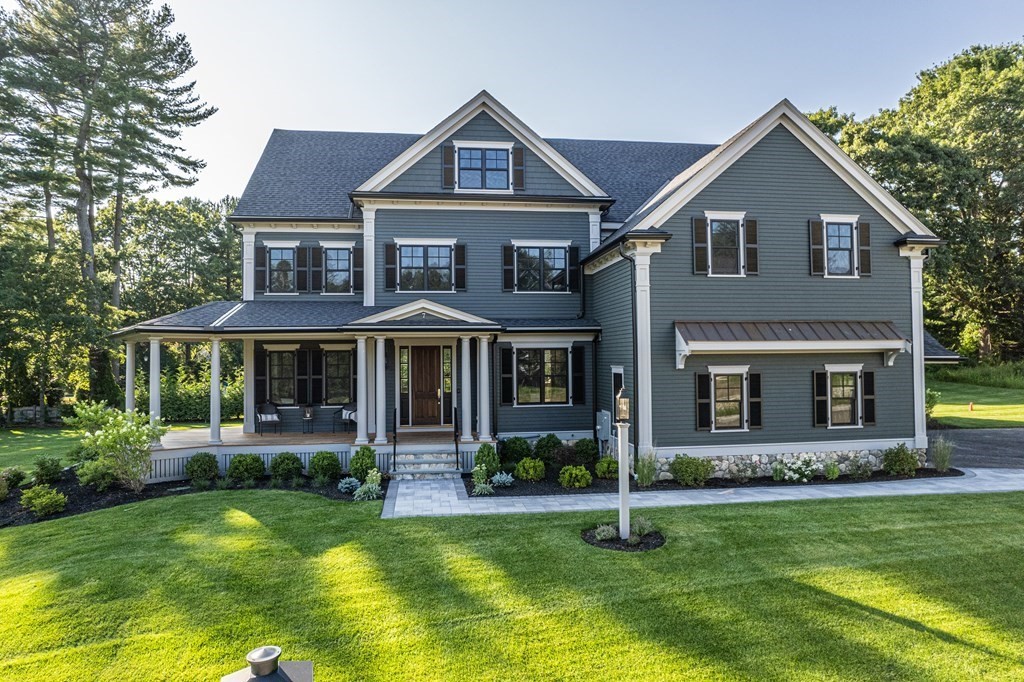 7 Tuttle Lane Lynnfield, MA 01940 - Photo 1 of 5 a front view of a house with a yard and porch