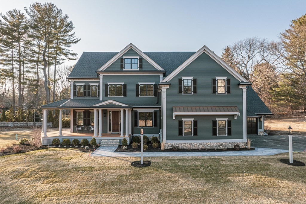 7 Tuttle Lane Lynnfield, MA 01940 - Photo 3 of 5 a front view of a house with garden
