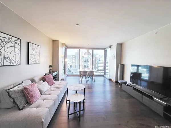 a living room with furniture and a flat screen tv