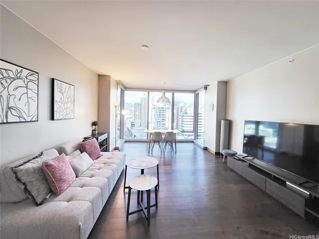 a living room with furniture and a flat screen tv