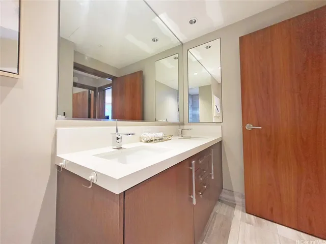 a bathroom with a sink and a mirror