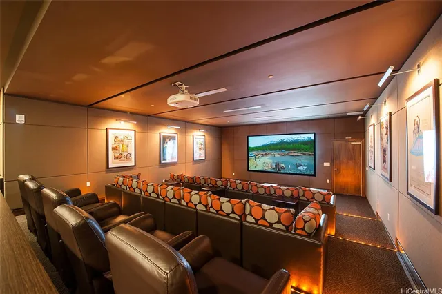 a room with furniture projector and screen