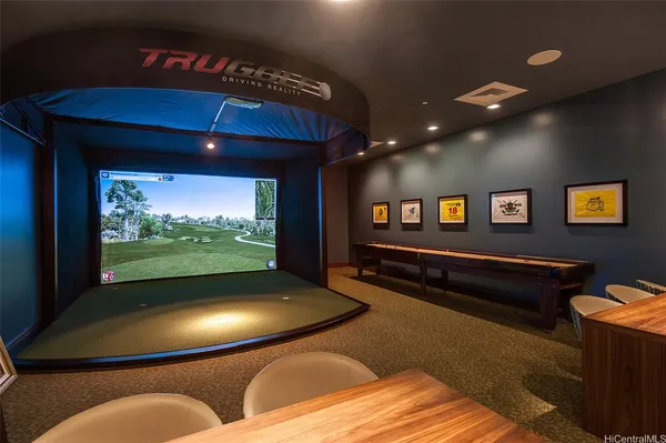 a view of a livingroom with furniture and floor to ceiling window