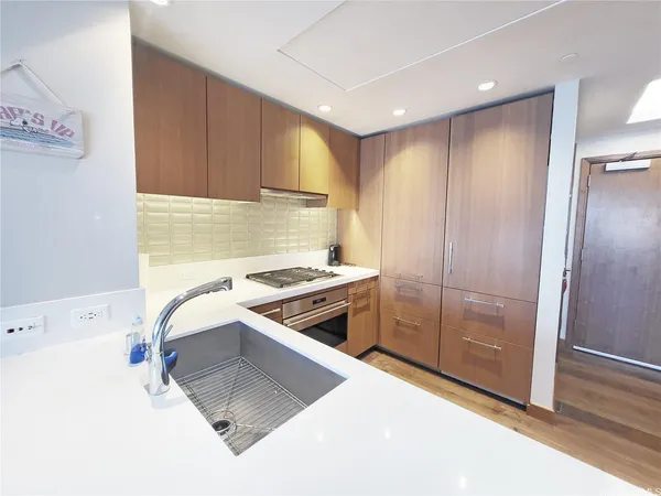 a kitchen with a stove and a refrigerator