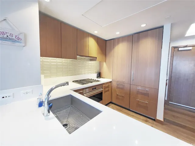 a kitchen with a stove and a refrigerator