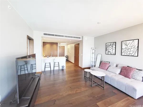 a living room with furniture and a table