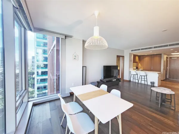 a view of a dining room with furniture window and wooden floor