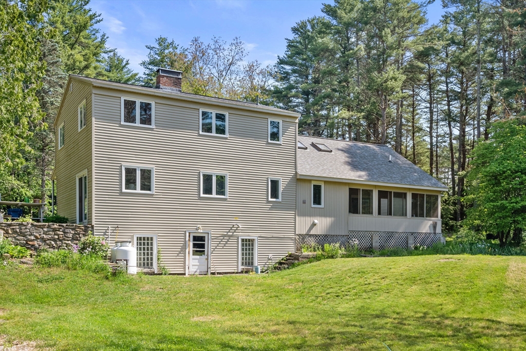 87 R Ruggles Street Gilbertville, MA 01031 - Photo 27 of 39 a front view of a house with a yard