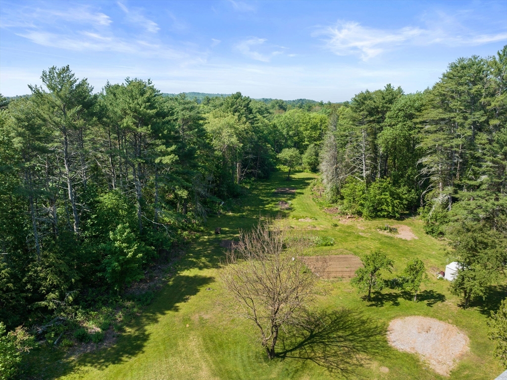 87 R Ruggles Street Gilbertville, MA 01031 - Photo 32 of 39 a view of a lake with a yard