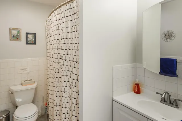 a bathroom with a toilet and a sink