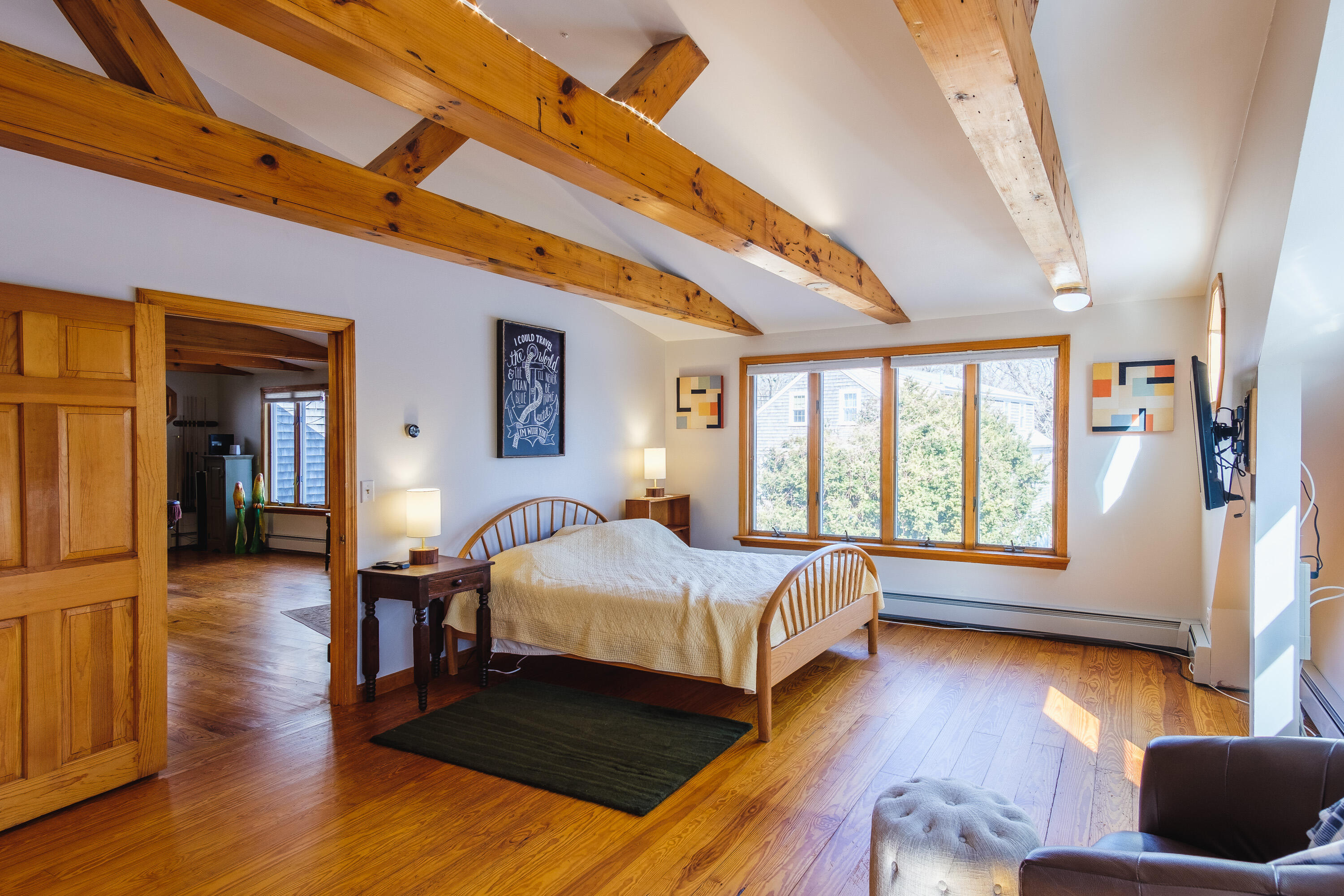 2 Huettner Road Woods Hole, MA 02543 - Photo 15 of 20 a bedroom with wooden floors and a bed
