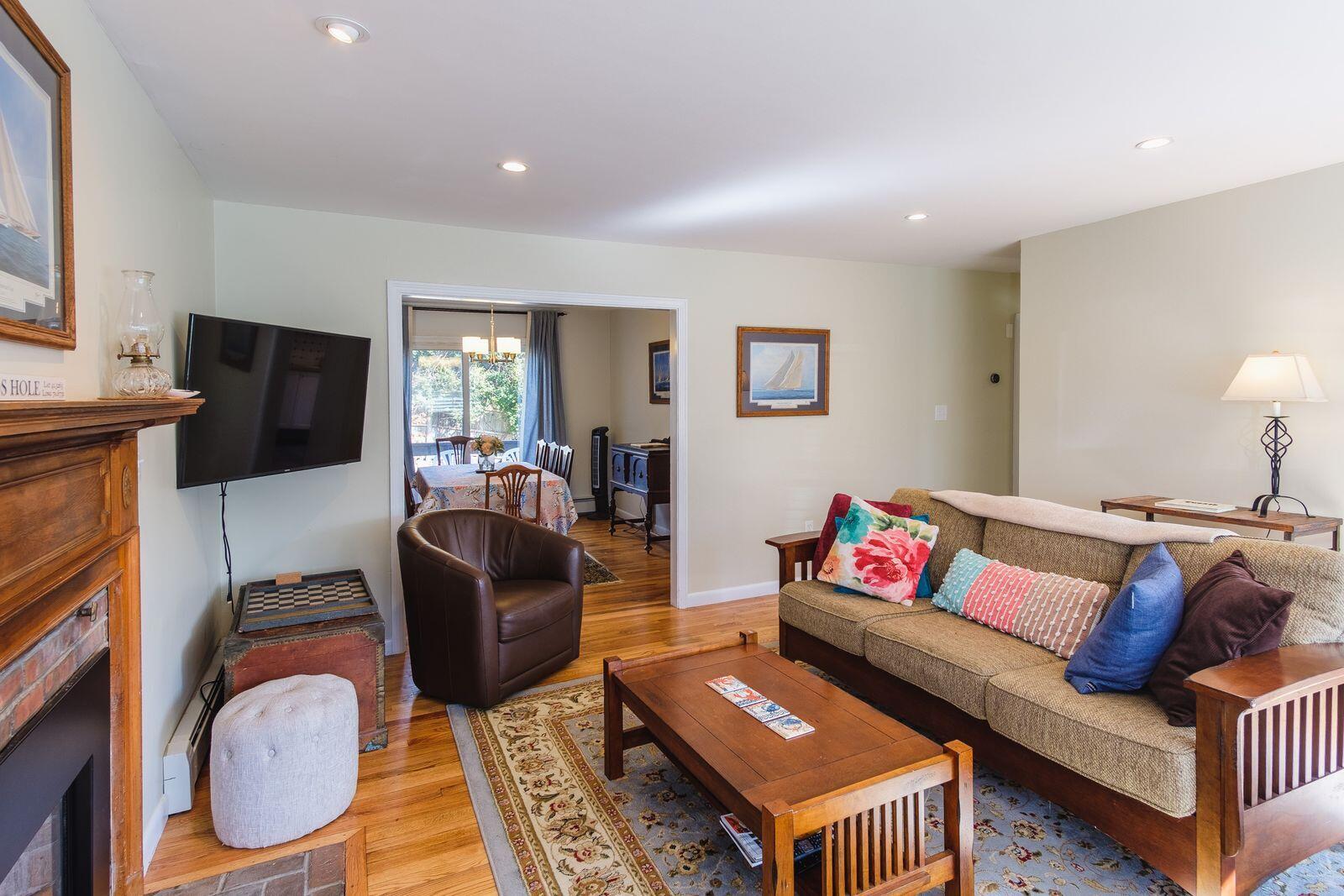 2 Huettner Road Woods Hole, MA 02543 - Photo 3 of 20 a living room with furniture and a flat screen tv