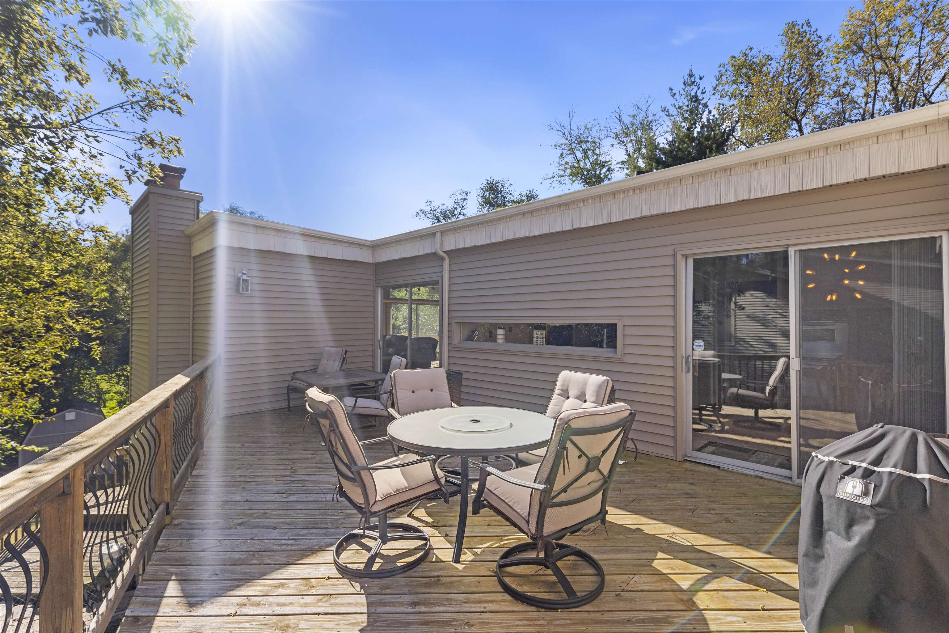 4969 Brookview Road Rockford, IL 61107 - Photo 12 of 34 a view of a patio with table and chairs with wooden floor and fence