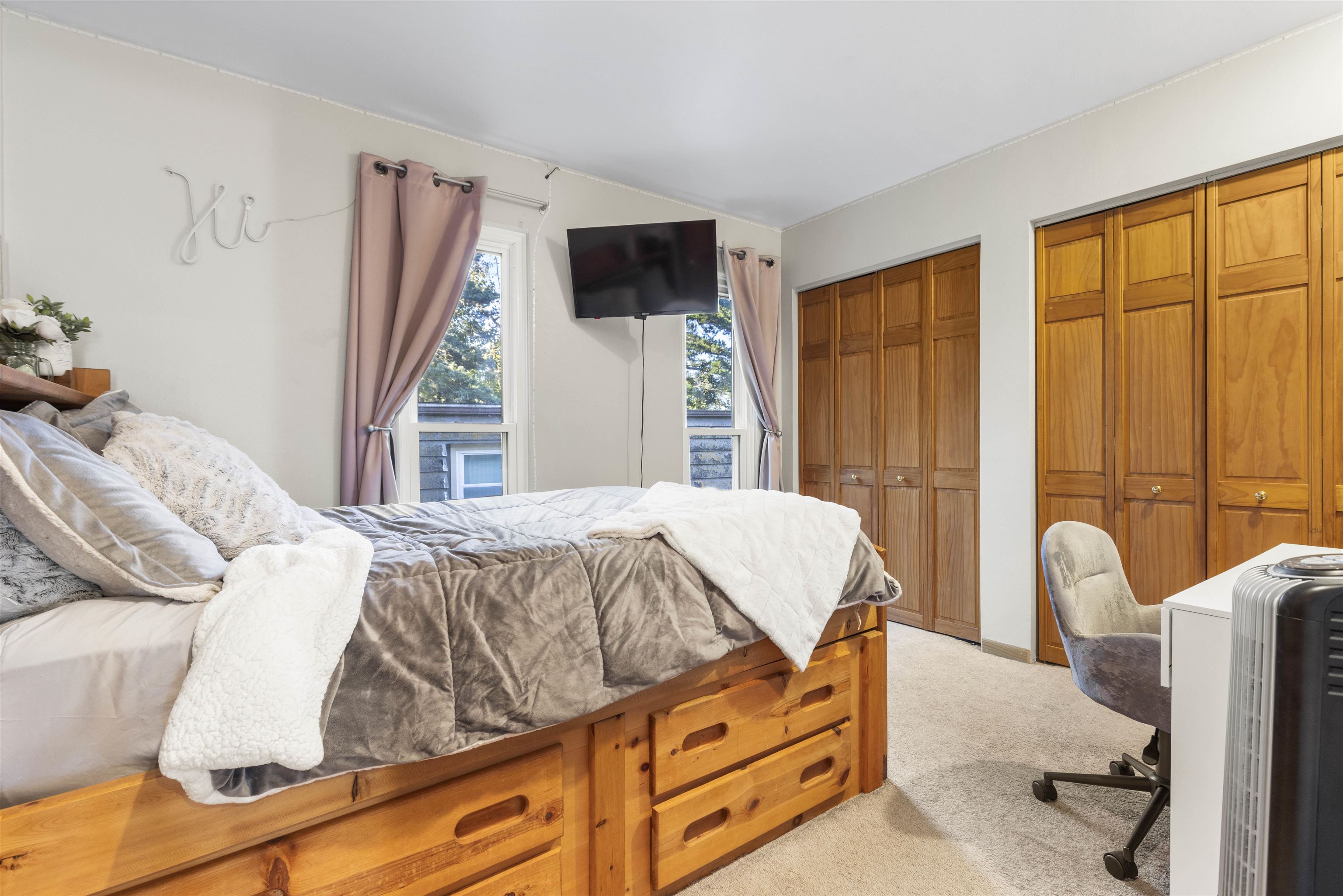 4969 Brookview Road Rockford, IL 61107 - Photo 14 of 34 a bed sitting in a bedroom next to a window