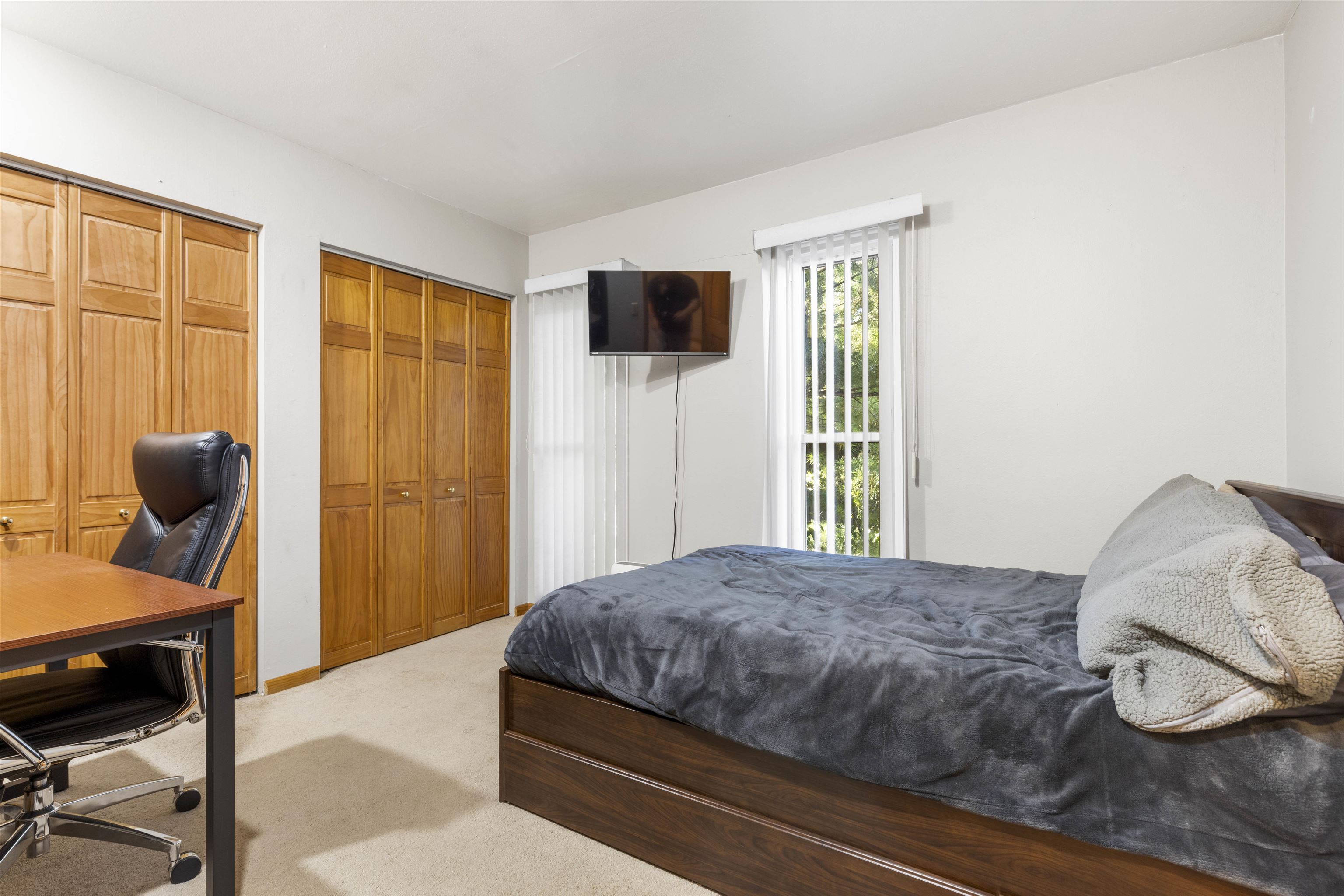 4969 Brookview Road Rockford, IL 61107 - Photo 15 of 34 a bedroom with a bed and a window