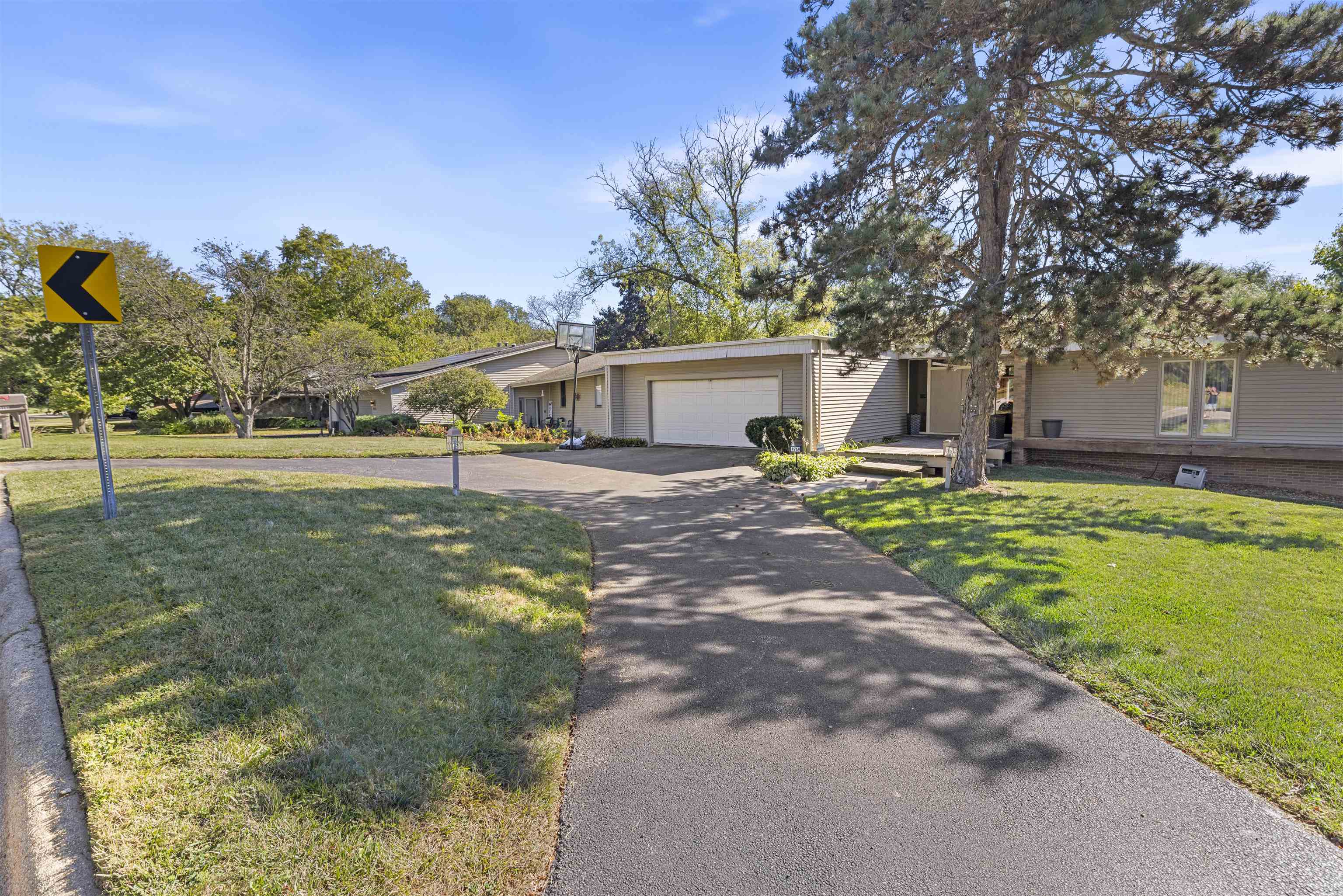 4969 Brookview Road Rockford, IL 61107 - Photo 2 of 34 a house view with swimming pool and sitting space