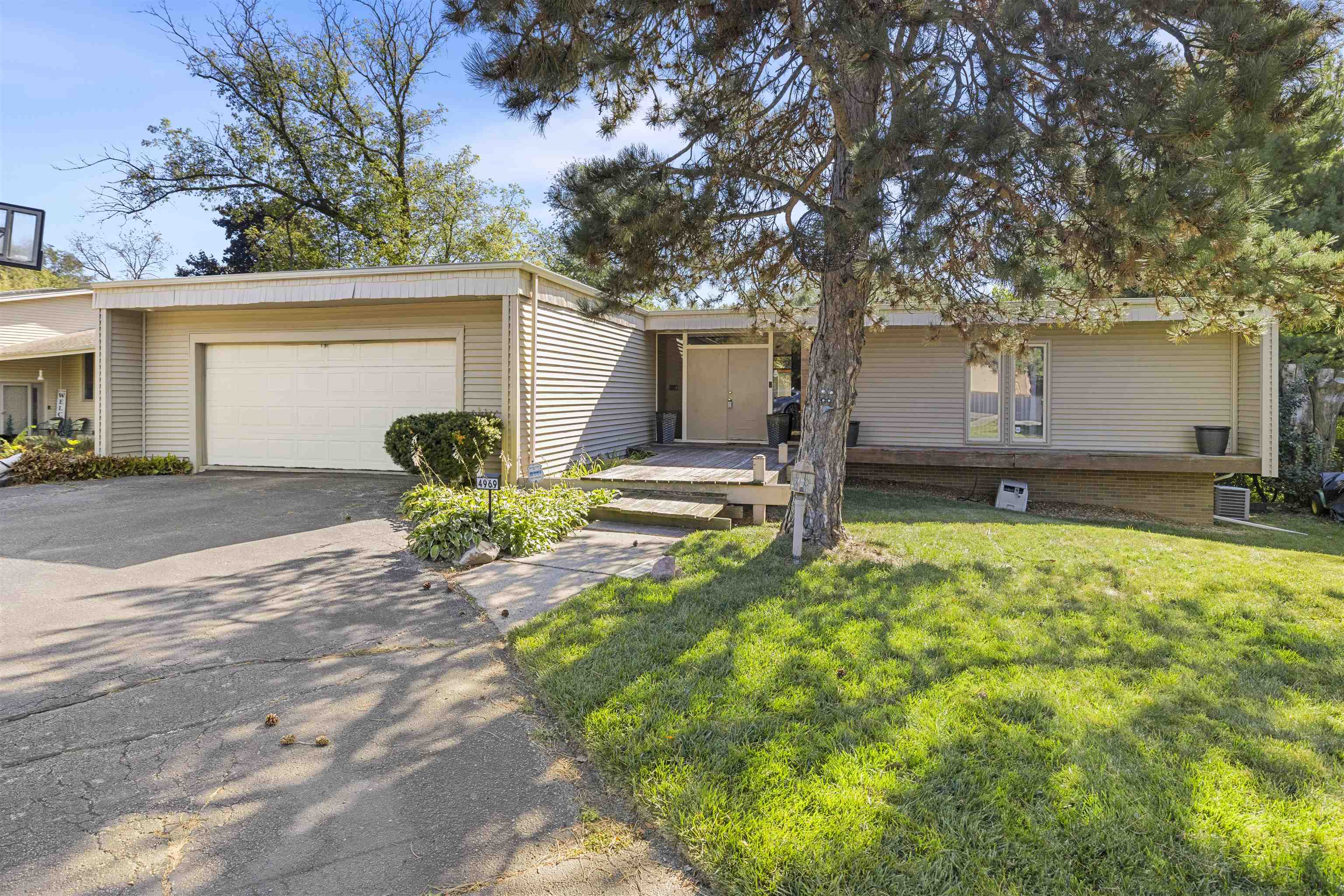 4969 Brookview Road Rockford, IL 61107 - Photo 3 of 34 a view of a house with backyard and tree