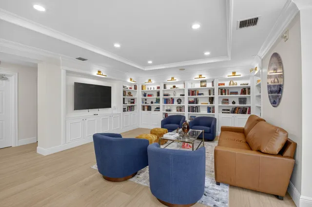 a kitchen with stainless steel appliances kitchen island granite countertop a table and chairs