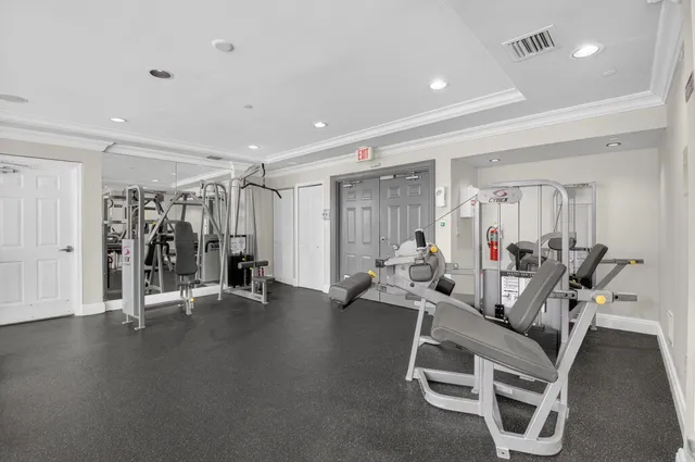 a living room with furniture a table and a chandelier