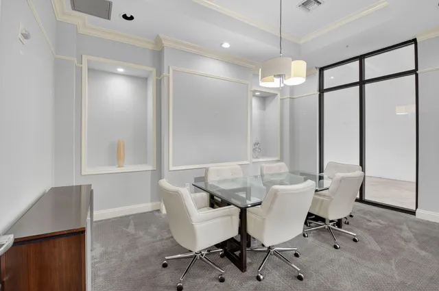 a view of a workspace with furniture