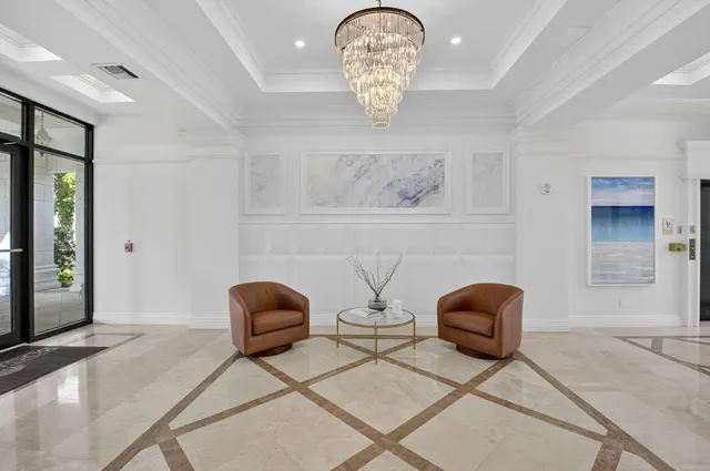 a view of a white building with many windows