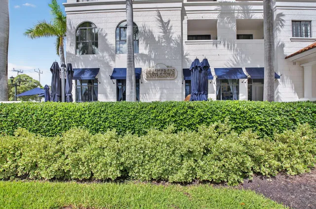 a street sign that is on a brick wall