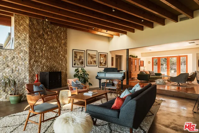 a outdoor living space with patio furniture and a fireplace