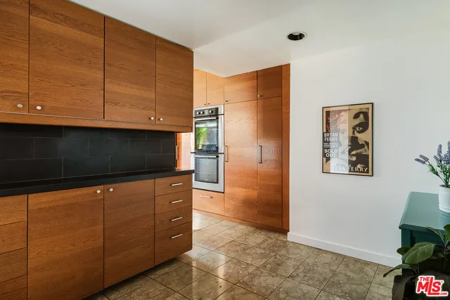 a bedroom with a large bed and a large window