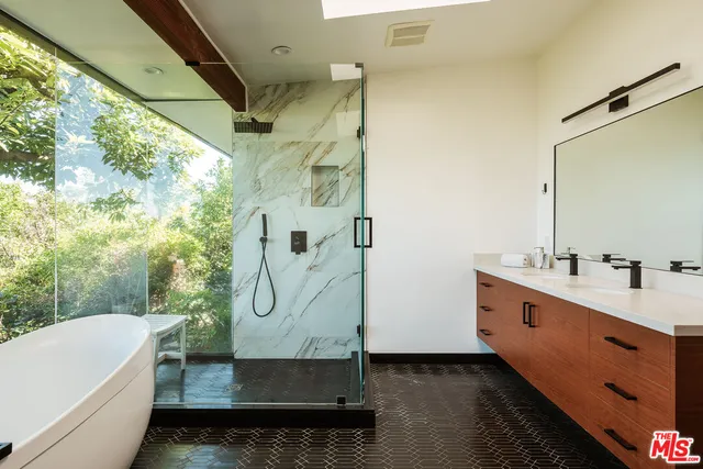 a view of a balcony with table and chairs