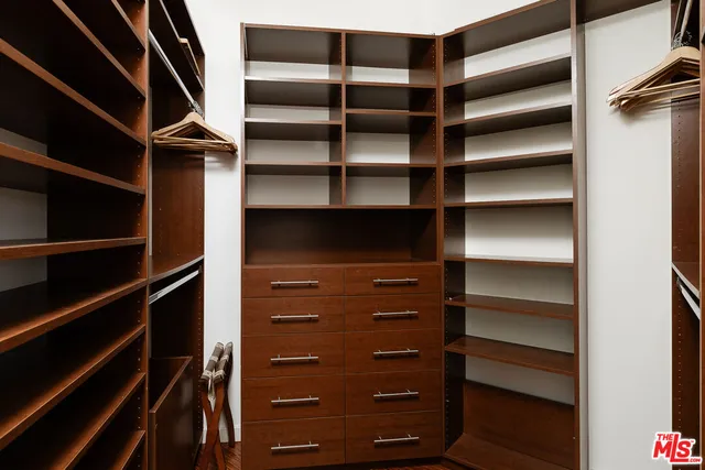 a bedroom with a large bed and a large window