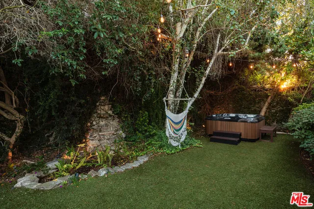 a view of a house with a yard and garage