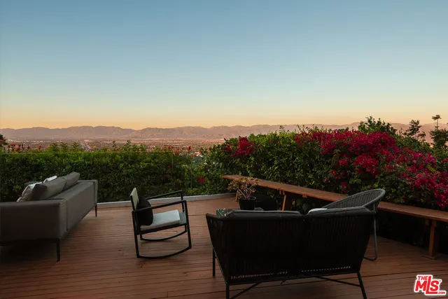 a outdoor living space with furniture and a potted plant