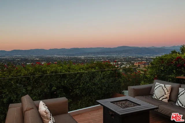 a terrace of a house with outdoor seating