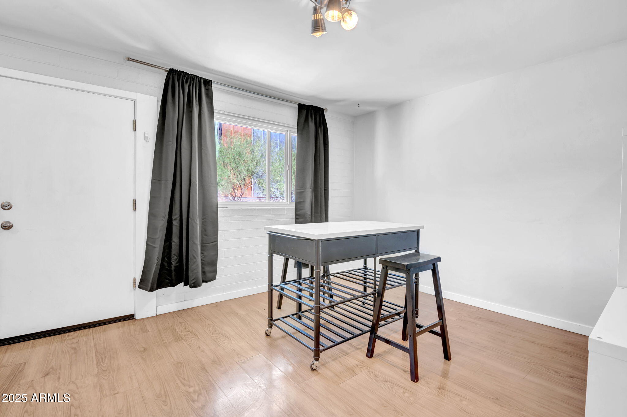 821 North 3rd Street, Unit 9 Phoenix, AZ 85004 - Photo 5 of 15 a view of a livingroom with furniture and wooden floor