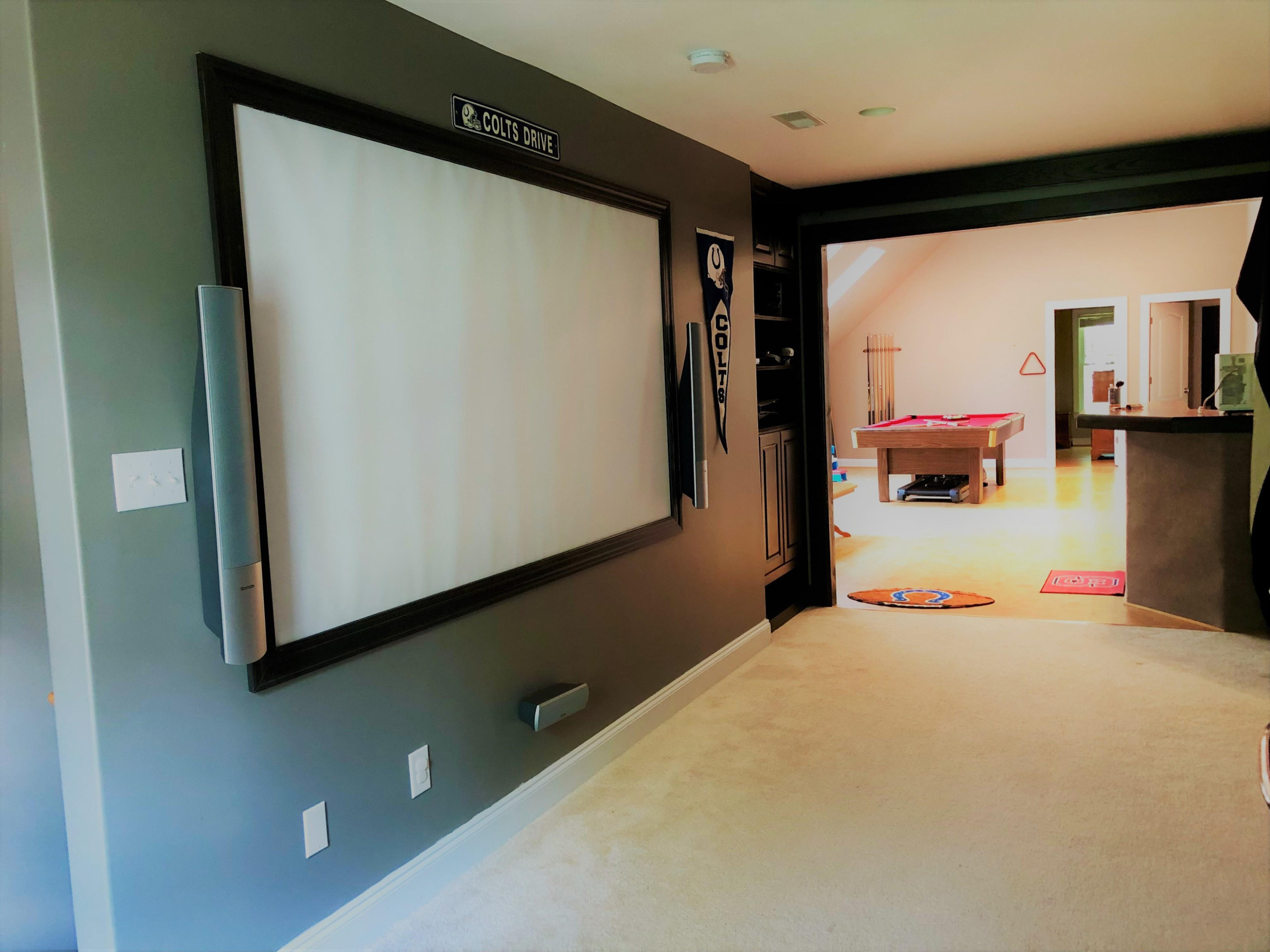 1309 Taylor Farm Road Raleigh, NC 27603 - Photo 22 of 38 View from theater into recreation room. Darkening curtains on rod between these rooms. Theater