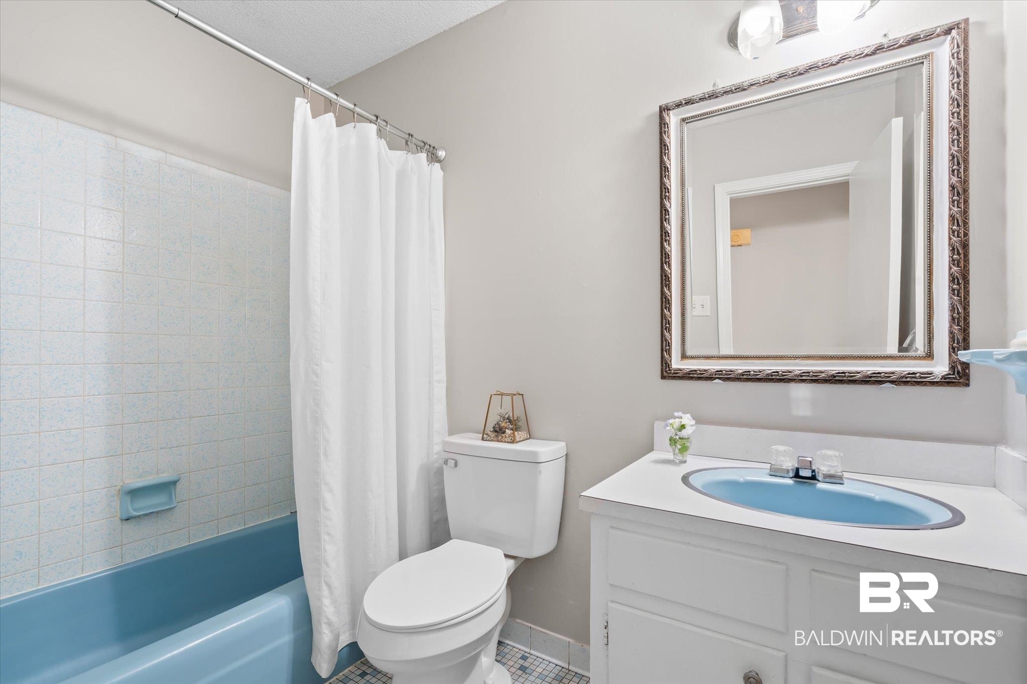 6848 Sandra Drive Theodore, AL 36582 - Photo 6 of 21 Full bathroom featuring vanity, shower / bath combination with curtain, and toilet