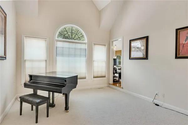 a room that has a bed and a chair in it
