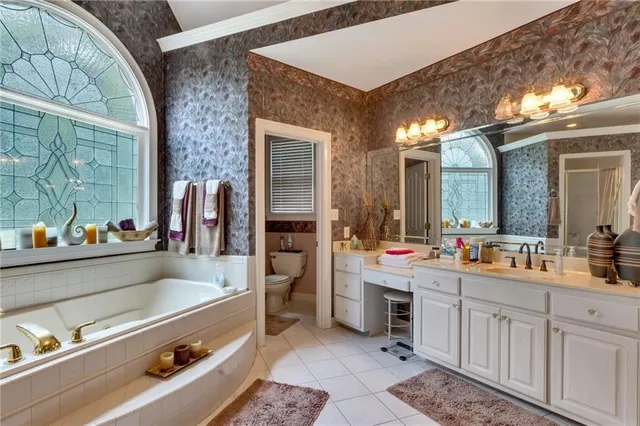 a large bathroom with a double vanity sink and a mirror