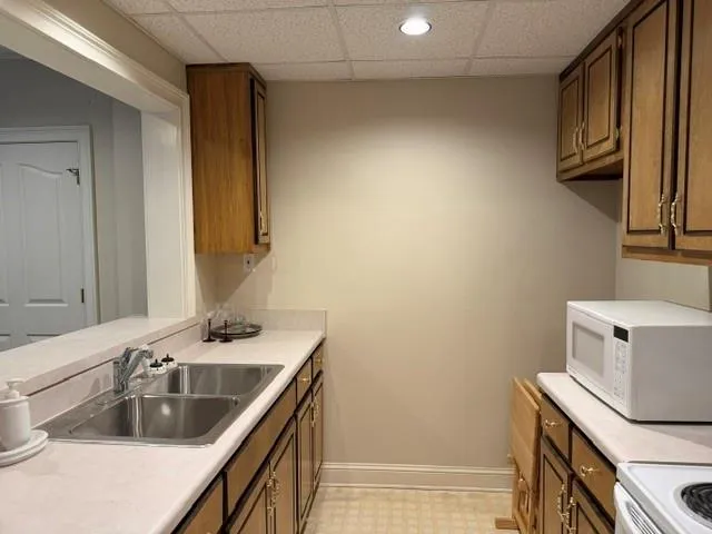 a bathroom with a sink a toilet and vanity