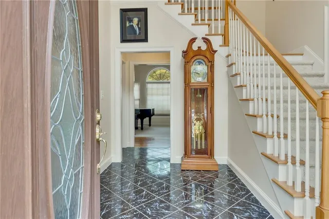 a view of an entryway with a front door