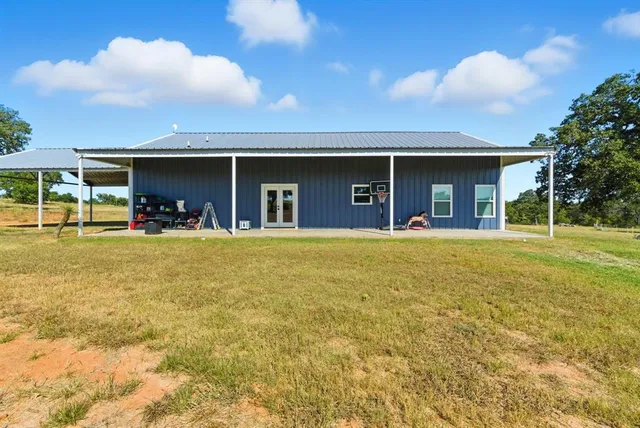 a view of a swimming pool with an outdoor seating