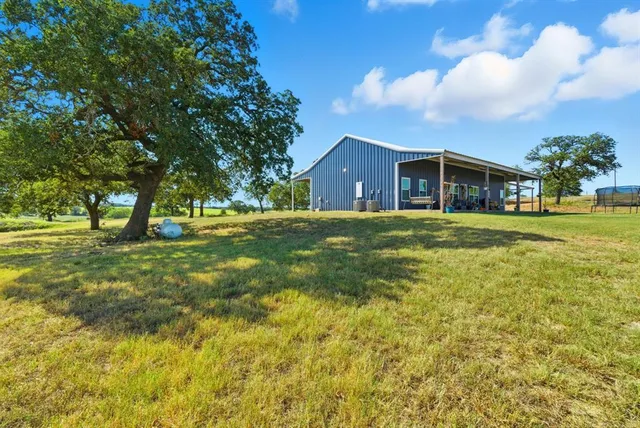 a view of a house with a big yard