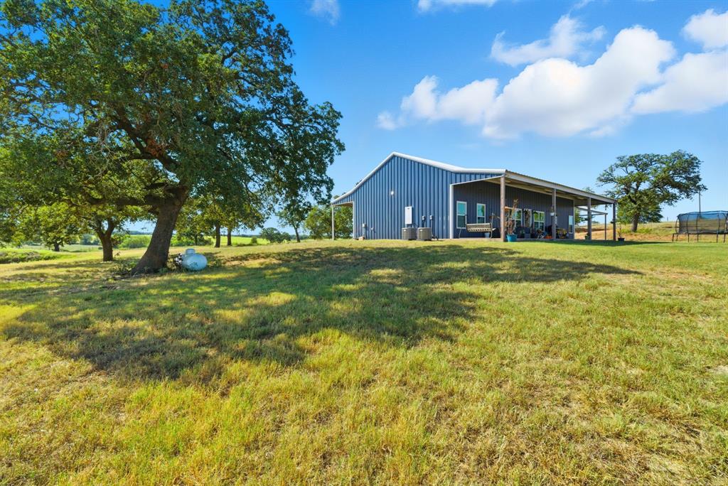 1734 Davis Road Lipan, TX 76462 - Photo 28 of 40 a view of a house with a big yard